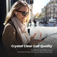 Woman on a city street holding a phone and a cup, with text about crystal clear call quality.
