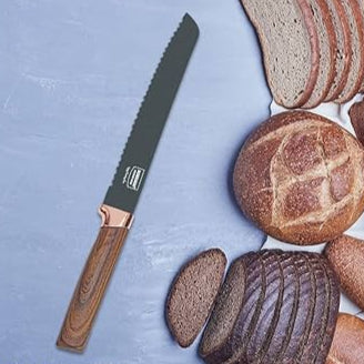 Bread knife with wooden handle next to sliced bread on a blue surface
