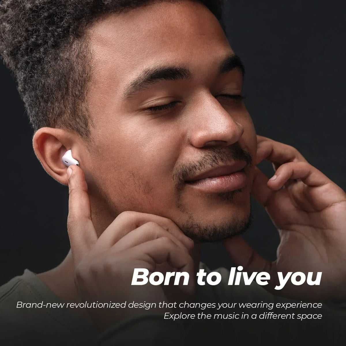 Man wearing wireless earbuds with text 'Born to live you' on a dark background