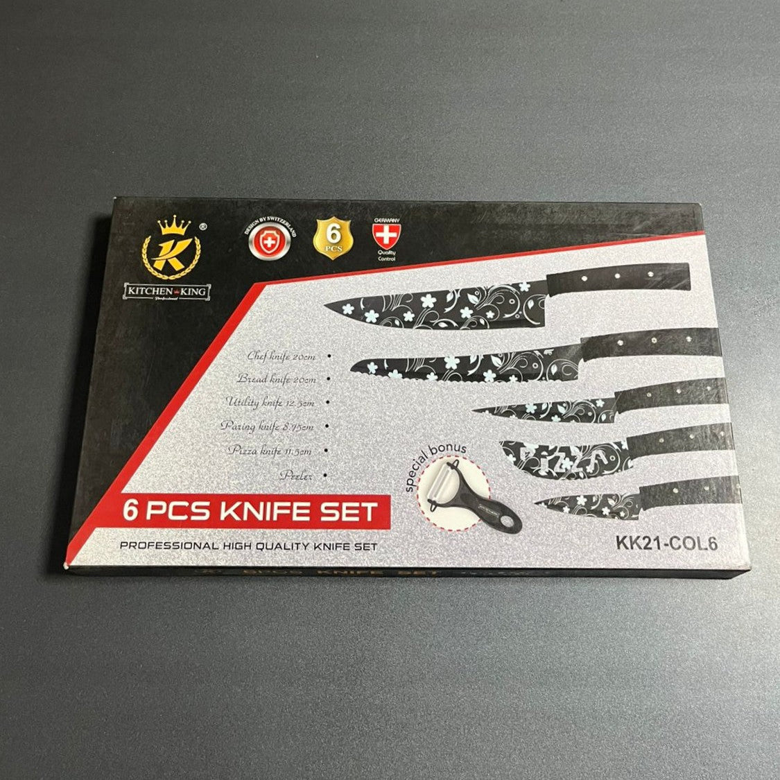 6-piece knife set packaging on a gray surface