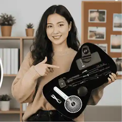 Woman holding a_ camera lens kit armaa store