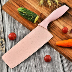 Pink knife with 'Buck-I' branding on a wooden cutting board with vegetables.